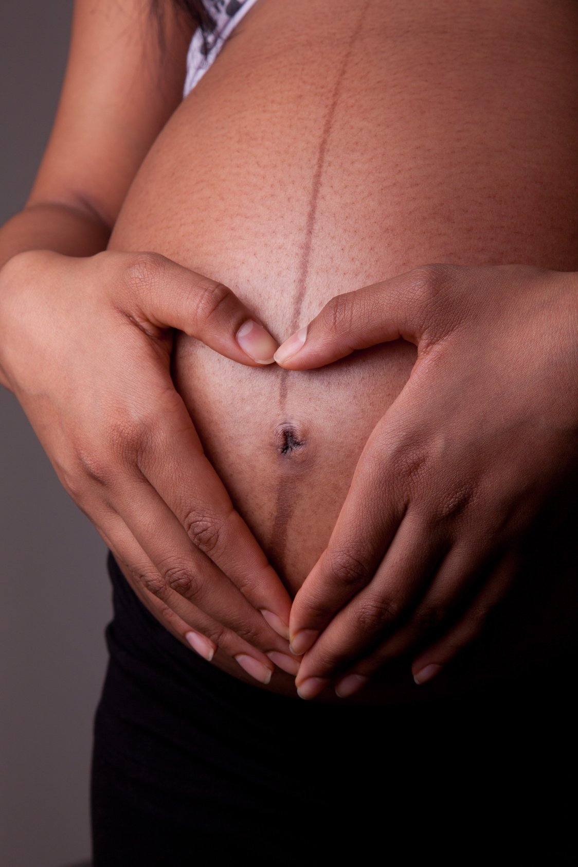 Close Up Shot of a Pregnant Woman's Baby Bump